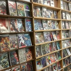 Bulletproof Comics - Completely redone comic racks.  Full cover shows without that ugly bar across the middle.