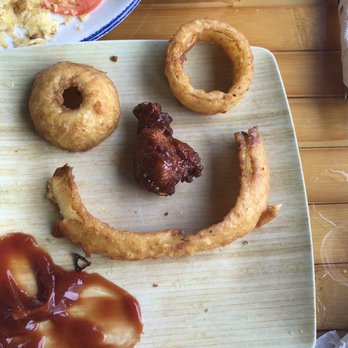 Bad Monkey - What's left of the onion ribs and a wing. - Burgers Near Me - Ocean City, Maryland