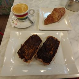 Cafe con leche, toast with hazelnut butter, and a strawberry croissant (all vegan and all delicious!) Cafe con leche, toast with hazelnut butter, and a strawberry croissant (all vegan and all delicious!)