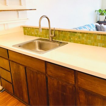Ahsing’s Construction - Other side of galley kitchen, new counters and backsplash - General Contractors Near Me