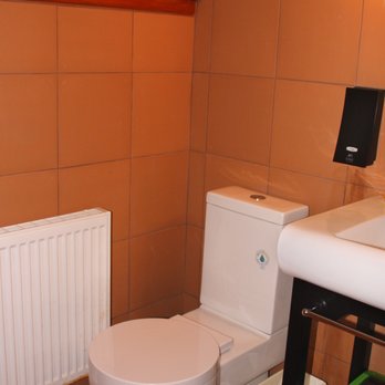 The Usonian Inn LLC - Room 2: Water-saving (green) toilet - Hotels Near Me - Spring Green, Wisconsin The Usonian Inn LLC - Room 2: Water-saving (green) toilet - Hotels Near Me - Spring Green, Wisconsin