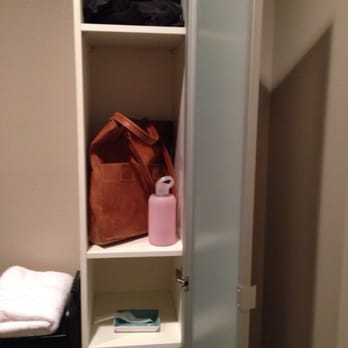 Rainglow Airbrush Tanning - Little cabinet to stow your belongings and also there are hair covers and disposable thongs on a shelf, too - Spray Tanning Near Me - Seattle, Washington Rainglow Airbrush Tanning - Little cabinet to stow your belongings and also there are hair covers and disposable thongs on a shelf, too - Spray Tanning Near Me - Seattle, Washington