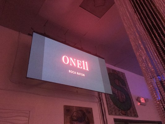 Photo of One11 Boca - Boca Raton, FL, US. a neon sign on the wall