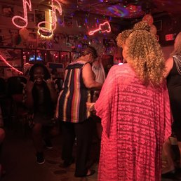 a group of people dancing in a bar a group of people dancing in a bar
