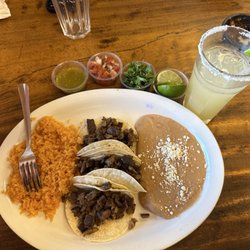 Los Mexicanos - Carne Asada Taco . They have a salsa bar . Add the toppings you want .