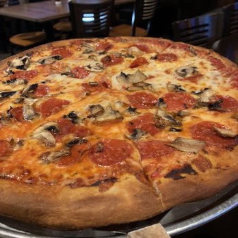 Ravenswood Pub - Mama's recipe for wood fired pizza, yummy! If anything might have pulled it out a minute or two sooner. - American Near Me - Clifton Park, New York Ravenswood Pub - Mama's recipe for wood fired pizza, yummy! If anything might have pulled it out a minute or two sooner. - American Near Me - Clifton Park, New York