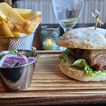 Paititi Peruvian Bistro - Yes, that sandwich is easily 3-4 inches tall. Tasty garnish. Lovely presentation. - Peruvian Near Me - Sacramento, California