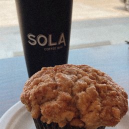 Apple cinnamon muffin with bee knees iced latte in their own souvenir cup Apple cinnamon muffin with bee knees iced latte in their own souvenir cup