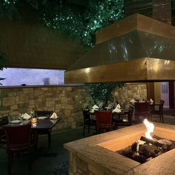 Vic Stewart's - An indoor fire pit that adds to the ambience of the steakhouse - Steakhouses Near Me - Brentwood, California