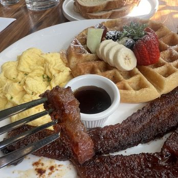 Lapisara Eatery - Belgium waffle with two scrambled eggs, a side of Queens B bacon, and sourdough toast. Look how thick the bacon is! - Breakfast & Brunch Near Me - San Francisco, California