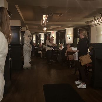 Papa Razzi- Wellesley -  a group of people in a restaurant - Italian Near Me - Wellesley, Massachusetts