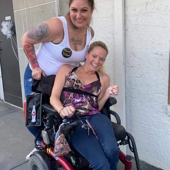 Cowboy Saloon Bar - a woman in a wheelchair with a tattooed arm - Dive Bars Near Me - Dallas, Texas Cowboy Saloon Bar - a woman in a wheelchair with a tattooed arm - Dive Bars Near Me - Dallas, Texas