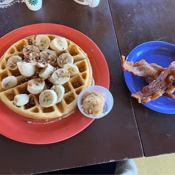 Wildflower Café - Banana Nut Waffle w/ side of bacon - Bakeries Near Me - Tulsa, Oklahoma Wildflower Café - Banana Nut Waffle w/ side of bacon - Bakeries Near Me - Tulsa, Oklahoma