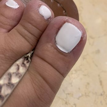 Marguerite's Nail Boutique - This has too much polish you can see at the cuticle line because of that will be lifting notice the polish around the toes - Nail Salons Near Me - Spokane, Washington