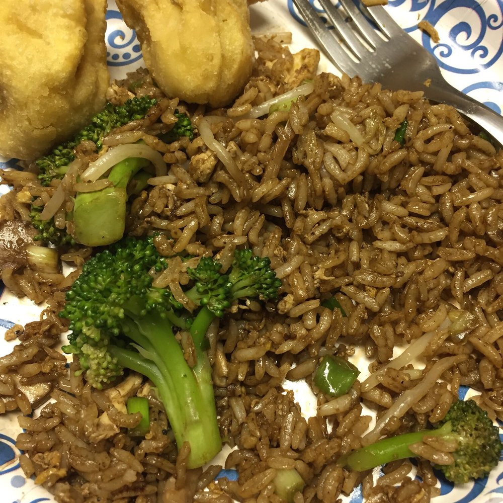 a plate of rice and broccoli a plate of rice and broccoli