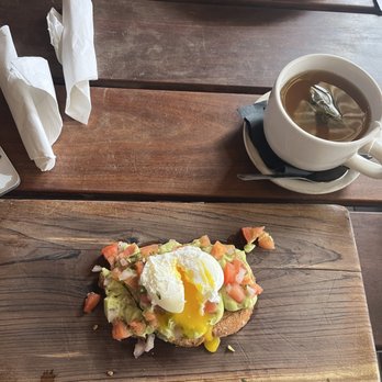 Brasil - Avocado toast with poached egg and jasmine green tea. - Breakfast & Brunch Near Me - Houston, Texas Brasil - Avocado toast with poached egg and jasmine green tea. - Breakfast & Brunch Near Me - Houston, Texas