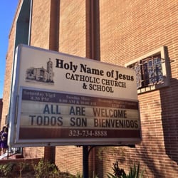 Holy Name of Jesus Catholic Church - Sign out front of church. "All Are Welcome."