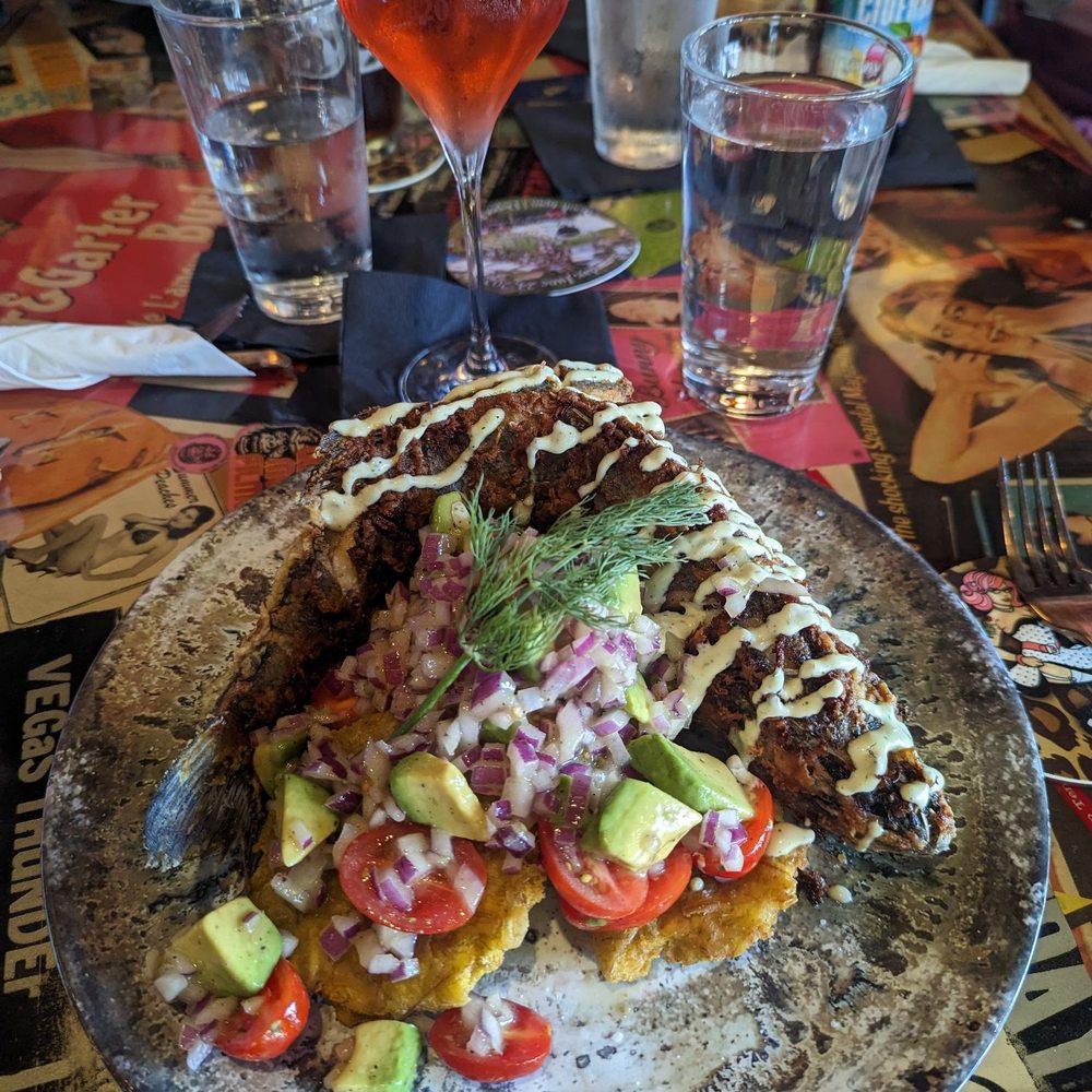 Galena Taphouse - Whole fried sea bass with fried plantains and avocado and red onions and tomatoes. Absolutely delicious! - Bars Near Me - Galena, Illinois Galena Taphouse - Whole fried sea bass with fried plantains and avocado and red onions and tomatoes. Absolutely delicious! - Bars Near Me - Galena, Illinois
