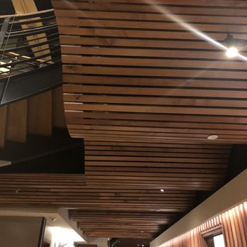 Duke's La Jolla - Interior wavy wood slats ceiling design - New American Near Me - La Jolla, California