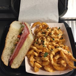 Voodoo Kitchen - Toasted Muffaletta Wedge with Voodoo Curly Fries