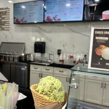 Dumont Creamery & Cafe - Mint chip ice cream in a waffle cone, menu back wall - Ice Cream & Frozen Yogurt Near Me - Northlake, Texas Dumont Creamery & Cafe - Mint chip ice cream in a waffle cone, menu back wall - Ice Cream & Frozen Yogurt Near Me - Northlake, Texas
