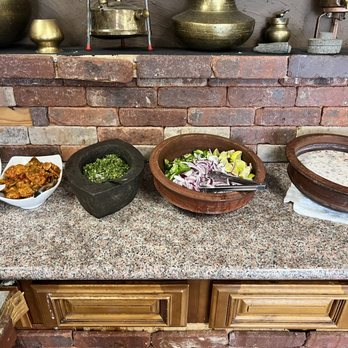 Thecha - Condiments setup (sweet chutney, pickle, thecha, onions and lemons, raita) - Indian Near Me - Sunnyvale, California Thecha - Condiments setup (sweet chutney, pickle, thecha, onions and lemons, raita) - Indian Near Me - Sunnyvale, California