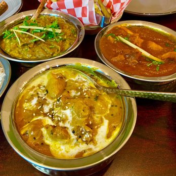 Krsma - Clockwise from top: Eggplant Bartha, Fish Vindaloo, Chicken Chettinad - Indian Near Me - Vancouver, British Columbia Krsma - Clockwise from top: Eggplant Bartha, Fish Vindaloo, Chicken Chettinad - Indian Near Me - Vancouver, British Columbia