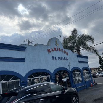 Mariscos El Paisa - a car parked in front of a restaurant - Mexican Near Me - Whittier, California