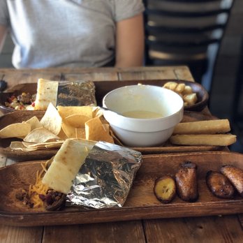 Barroco - Cheesy Corn with Chicken, Mexicana Arepa with Maduros, La Sucia Arepa with Yuca Fries - Latin American Near Me - Cleveland, Ohio Barroco - Cheesy Corn with Chicken, Mexicana Arepa with Maduros, La Sucia Arepa with Yuca Fries - Latin American Near Me - Cleveland, Ohio