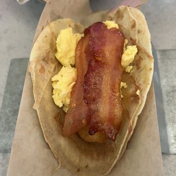 Velvet Taco - Velvet Griddle: a tortilla-thin piece of French toast, scrambled egg, tater tots, and candied bacon. - Tacos Near Me - Houston, Texas Velvet Taco - Velvet Griddle: a tortilla-thin piece of French toast, scrambled egg, tater tots, and candied bacon. - Tacos Near Me - Houston, Texas