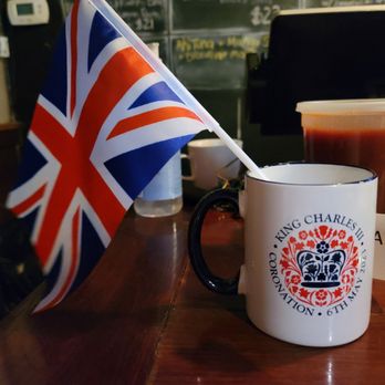The Queen Vic - a british flag and a cup of coffee - Pubs Near Me - Washington, DC, District of Columbia