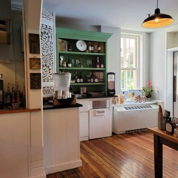 The Pantry - a kitchen with wood floors and white cabinets - Coffee & Tea Near Me - Jekyll Island, Georgia