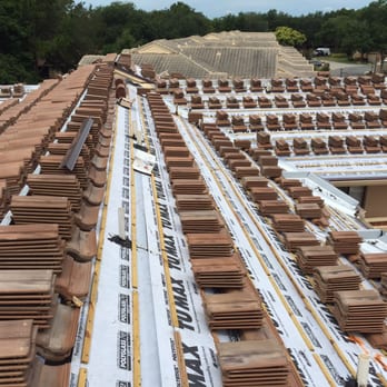 Schick Roofing - Locked and loaded for this large concrete tile re-roof in Dr. Phillips - Roofing Near Me - Orlando, Florida Schick Roofing - Locked and loaded for this large concrete tile re-roof in Dr. Phillips - Roofing Near Me - Orlando, Florida