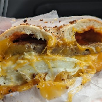 Bethesda Bagels - Scooped garlic bagel with sausage, egg whites, cheese, and Sriracha! - Bagels Near Me - Bethesda, Maryland