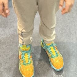 Champs Sports - Trying what were supposed to be his new shoes!