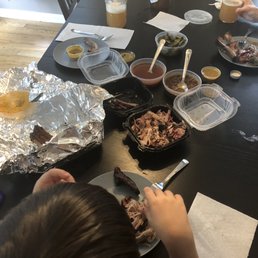 Pork ribs, 3/4# pulled pork, 1/4# brisket, baked beans, collard greens, and some suds from the brewery next door.