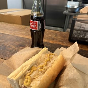 Berlin Currywurst - Nürnberger with sauerkraut and onions and a Mexican Coke - German Near Me - New York, New York Berlin Currywurst - Nürnberger with sauerkraut and onions and a Mexican Coke - German Near Me - New York, New York