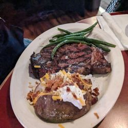 Pete's Tavern - Ribeye steak with loaded baked potato and green beans