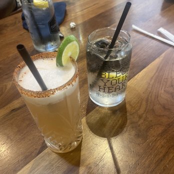 Tupelo Honey Southern Kitchen & Bar - Watermelon margarita with a glass of lemon water - Breakfast & Brunch Near Me - Chattanooga, Tennessee Tupelo Honey Southern Kitchen & Bar - Watermelon margarita with a glass of lemon water - Breakfast & Brunch Near Me - Chattanooga, Tennessee