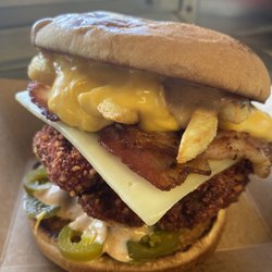 Hot Cheeto Fried Chicken Sandwich , has Spicy Sauce Jalapenos Pepper Jack Cheese Bacon Fry's Nacho Cheese s PLEASE BE WARNED THIS