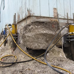Casey Ferreira Construction - Push piers installed to exterior of slab and raised back to level from over 6 in. of settlement