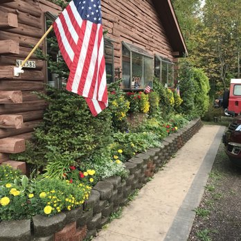Black River Valley Pub - an american flag on the side of a building - Pubs Near Me - Bessemer, Michigan