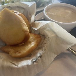 Bread with too much butter and cup of avgolemono soup