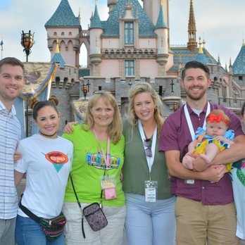 Magical Mouse Tours - Family Reunion trip with first grandbaby in front of Sleeping Beauty Castle in Disneyland. - Tours Near Me Magical Mouse Tours - Family Reunion trip with first grandbaby in front of Sleeping Beauty Castle in Disneyland. - Tours Near Me