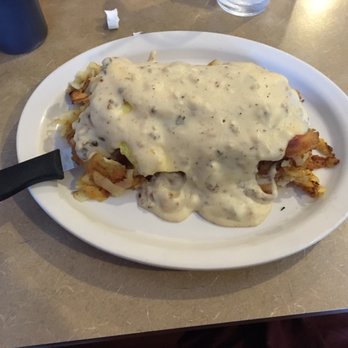 Kristof's Kafe - Kristof's Not So Benedict. Biscuits covered in hash brown, bacon, eggs, and the best darn sausage gravy you've ever tasted. - American Near Me - Davie, Florida