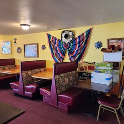 Los IV Hermanos - Interior picture of comfy booths, colorful blankets and Sombrero!