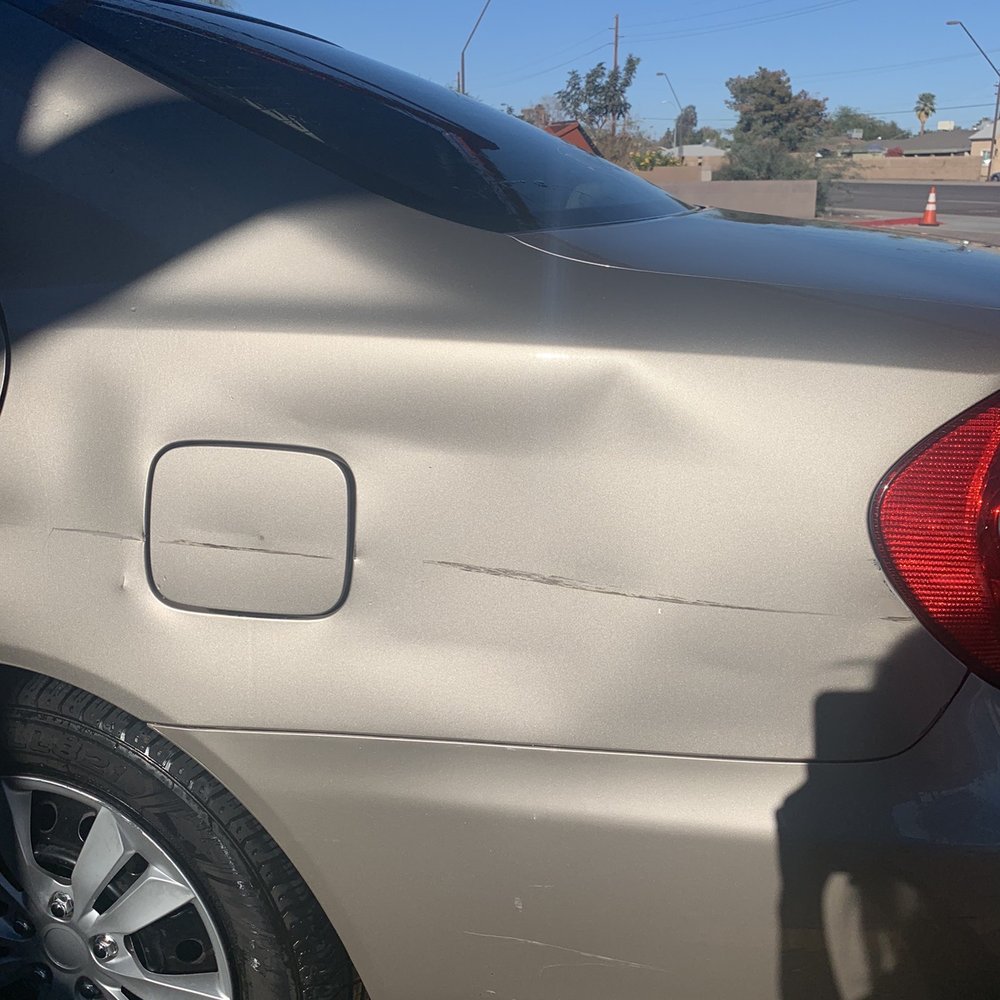 the side of the car wash severely dented and scratched his car
