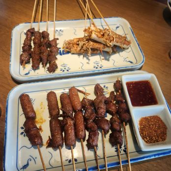 SLAP Hand Ripped Noodles - Skewers: mini pork sausage (a bit sweet), chicken gizzard, beef, and enoki mushroom with tofu skin - Noodles Near Me - Orlando, Florida SLAP Hand Ripped Noodles - Skewers: mini pork sausage (a bit sweet), chicken gizzard, beef, and enoki mushroom with tofu skin - Noodles Near Me - Orlando, Florida