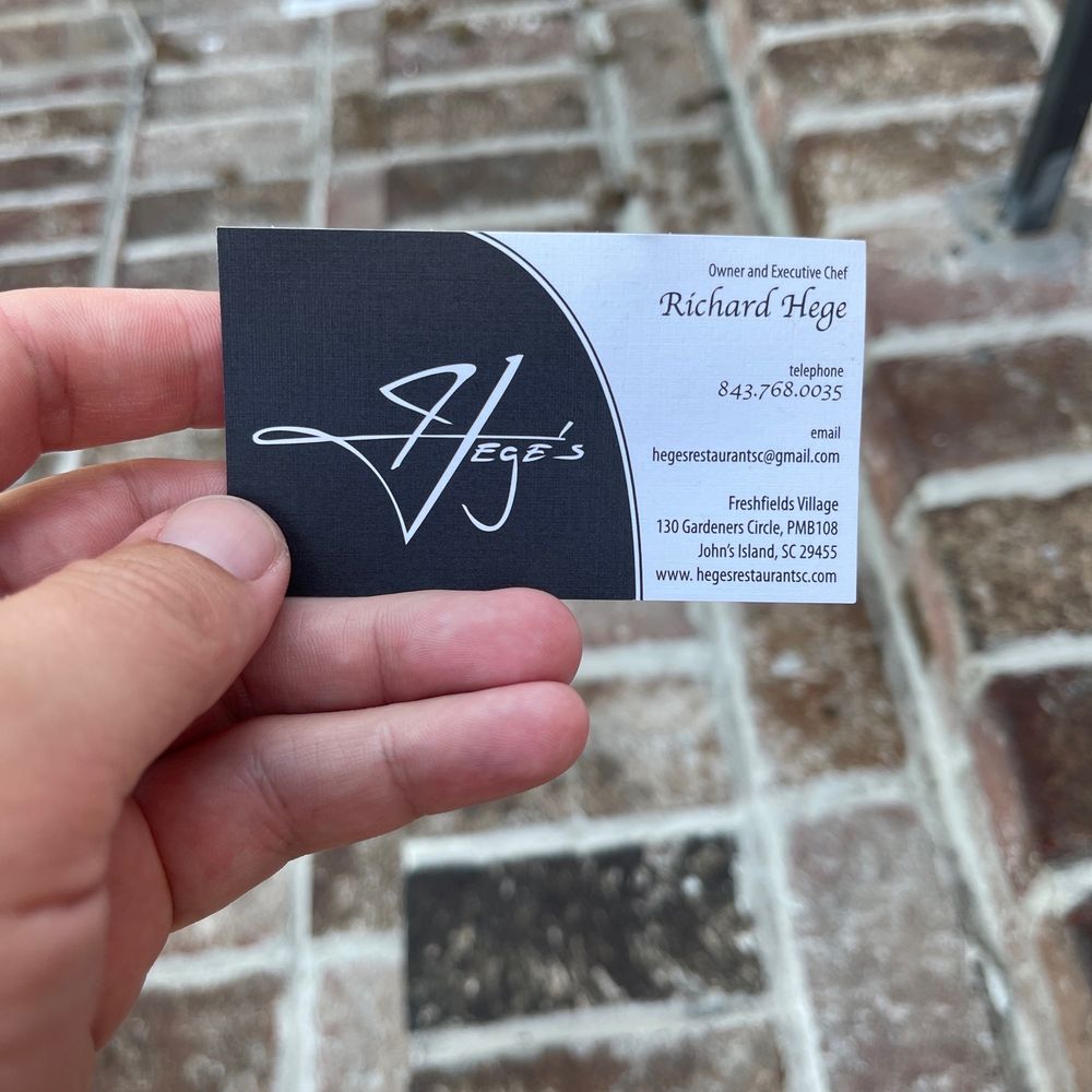 Hege's - a hand holding a business card - French Near Me - Johns Island, South Carolina