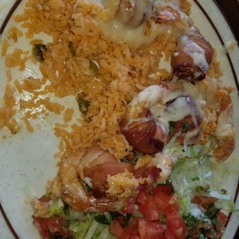 The Mazatlan Grill - Camarones Mazatlan Prawns wrapped in bacon & butter fried. Served on a bed of rice with melted Monterey Jack cheese. - Mexican Near Me - Susanville, California